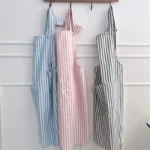 striped aprons on a wall in blue, pink and black