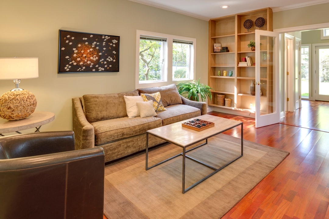 Compact living room with sofa and bookshelf using one wall for storage