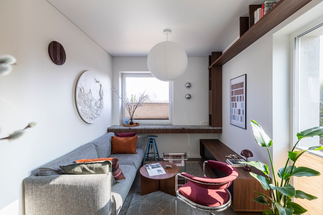 Compact small apartment living room with properly scaled sofa and flexible furniture
