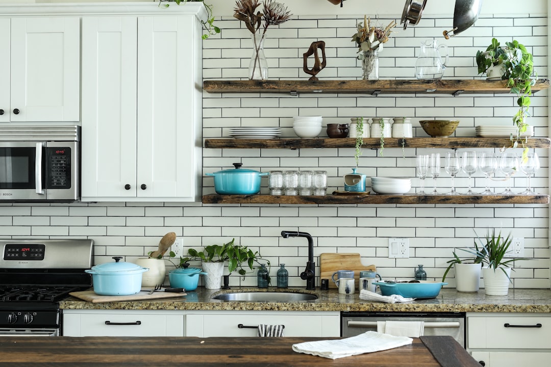 Organized small apartment kitchen with open shelves and accessible everyday storage